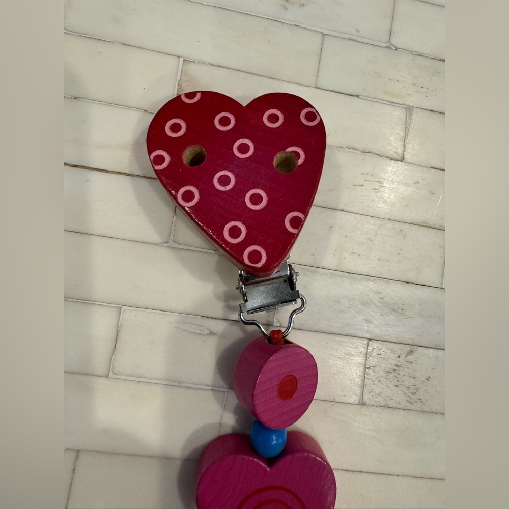 NWOT - Haba wooden hearts chain pacifier holder

Brand new without packaging.